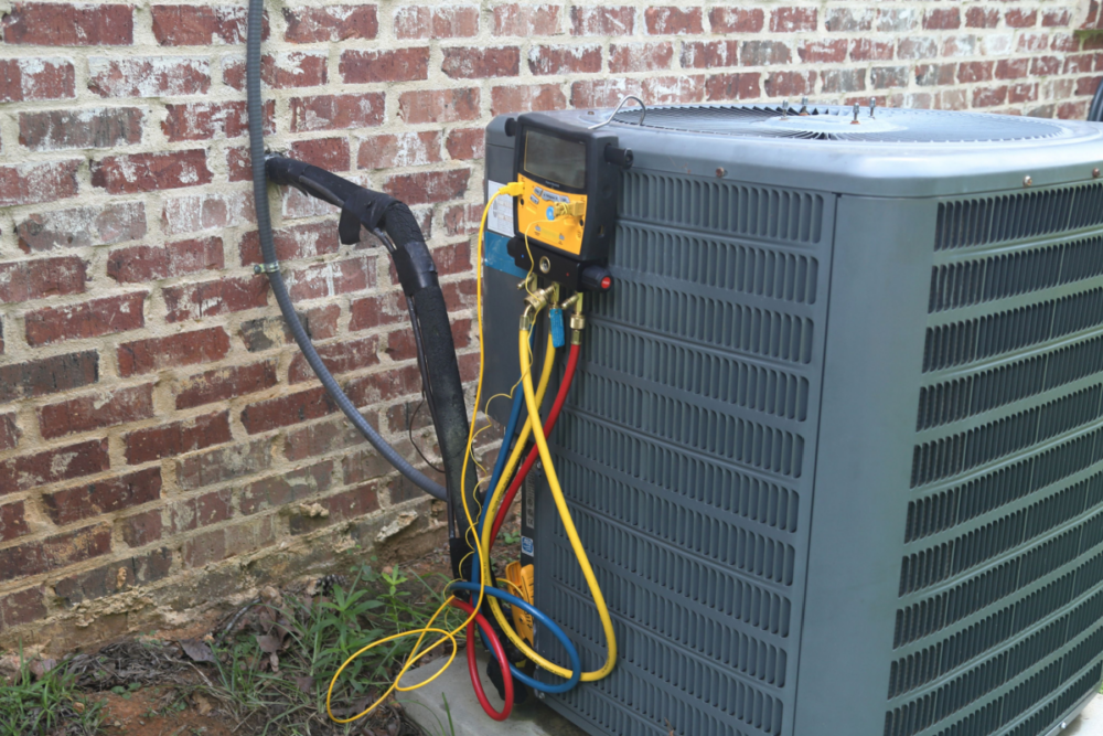 Outdoor air conditioning unit with attached diagnostic gauges