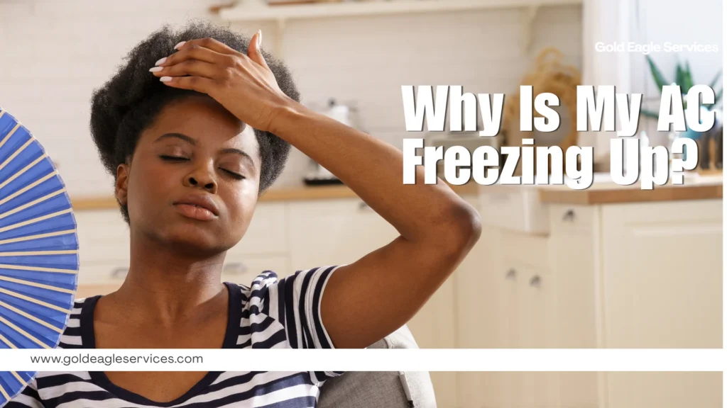 In a bright kitchen, a concerned woman fans herself as bold text asks, “Why Is My AC Freezing Up?”