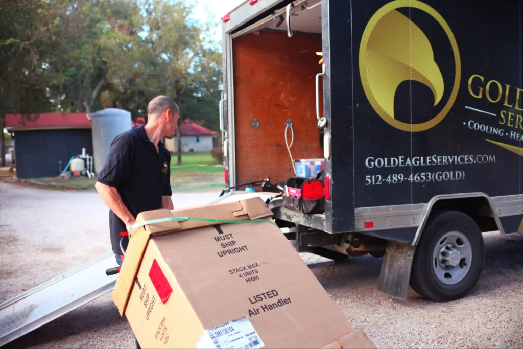 Gold Eagle Services HVAC installer loading an air handler