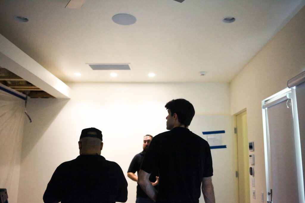 Gold Eagle team walking through a home under renovation before an HVAC install