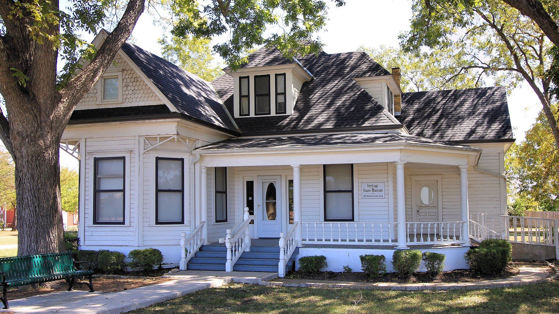 Bohls House, the Pflugerville Heritage House Museum, a white 1913 Victorian house shaded by trees in Pflugerville, Texas